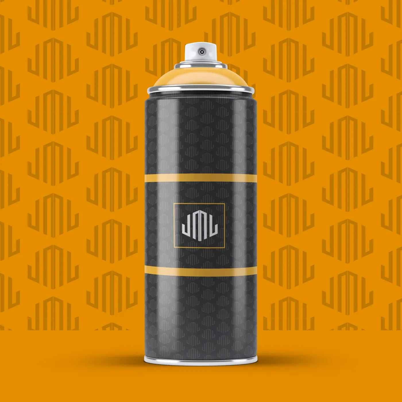 Black spray can wrapped in the JML pattern with gold bands and a framed white monogram, on an orange JML pattern backdrop